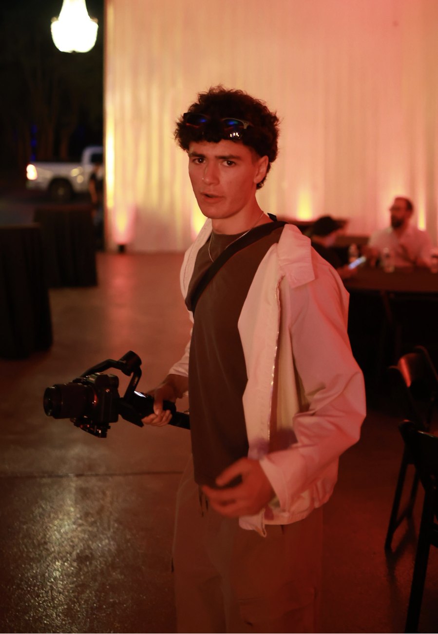 Ryan filming with a gimbal at an event
